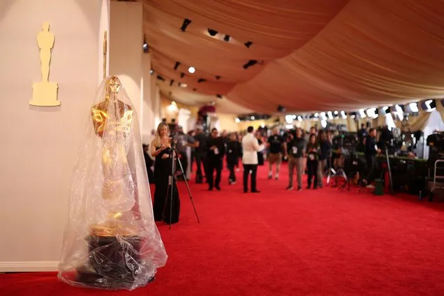 An Oscar statue is covered in plastic as preparations continue for the 96th Academy Awards in Los Angeles, California, U.S., March 9, 2024. (Photo by Mario Anzuoni/Reuters)