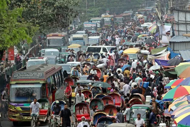 Vehicles jam on a street in Dhaka, Bangladesh on March 20, 2024. Lack of skilled drivers and traffic police, a faulty traffic signal systems and the huge amount of vehicles are regarded the main reason for traffic congestion which create daily sufferings for commuters. (Photo by Habibur Rahman/ZUMA Press Wire/Rex Features/Shutterstock)