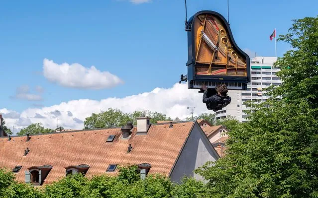 Pianist-composer Alain Roche playes his vertical piano during a performance on the occasion of an Open Day at the construction site of the future Theatre de Carouge, in Geneva, Switzerland, 16 June 2019. (Photo by Martial Trezzini/EPA/EFE/Rex Features/Shutterstock)