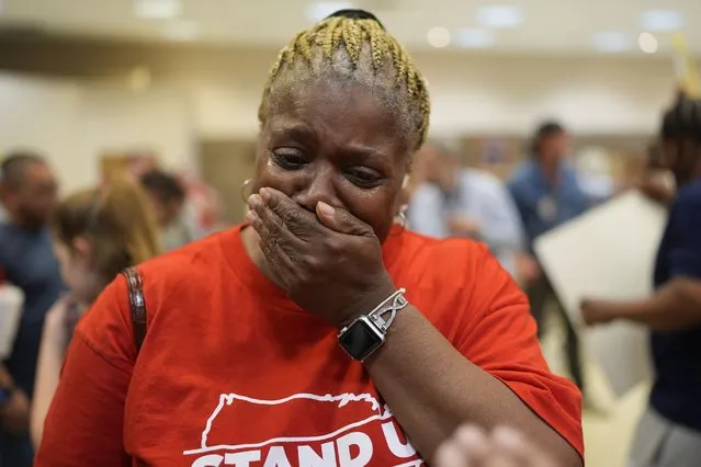 Volkswagen automobile plant employee Vicky Holloway becomes emotional as she celebrates after employees voted to join the UAW union Friday, April 19, 2024, in Chattanooga, Tenn. (Photo by George Walker IV/AP Photo)