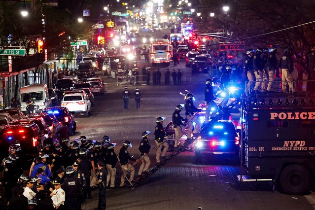 Police use a vehicle named "the bear" to enter Hamilton Hall from a public street, which was occupied by protesters, as other officers enter the campus of Columbia University, in New York City on April 30, 2024. (Photo by Caitlin Ochs/Reuters)