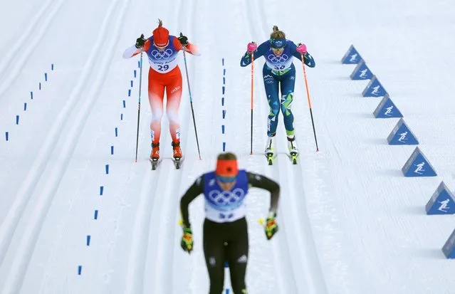 Katharina Hennig of Germany, Nadine Faehndrich of Switzerland and Anamarija Lampic of Slovenia in action during the Women's Cross-Country Skiing – 10km Classic at the Beijing Olympics on February 10, 2022. (Photo by Hannah Mckay/Reuters)