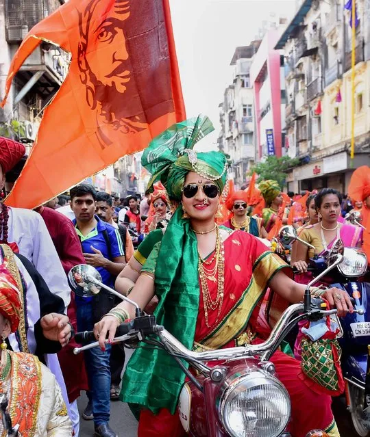 Women in traditional attires participate in a community parade (“Shobha Yatra”) to celebrate the Maharashtrian new year “Gudi Padwa”, in Mumbai, India on Tuesday, March 28, 2017. (Photo by Press Trust of India)