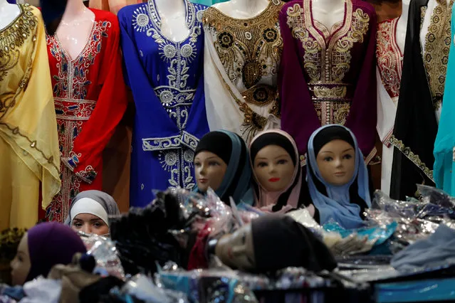 A stand displays women's clothes during the 34th annual meeting of French Muslims, the cultural and festive event organized by the Union of Islamic Organizations of France (UOIF) at Le Bourget, near Paris, April 14, 2017. (Photo by Philippe Wojazer/Reuters)