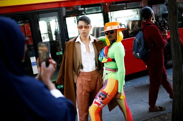 Fashionistas pose for photographers during London Fashion Week in London, Britain, September 13, 2019. (Photo by Henry Nicholls/Reuters)