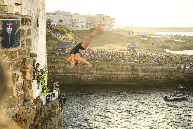 In this handout image provided by Red Bull, Meili Carpenter of the USA dives from the 20 metre balcony during the first competition day of the third stop of the Red Bull Cliff Diving World Series on June 28, 2024 at Polignano a Mare, Italy. (Photo by Romina Amato/Red Bull via Getty Images)