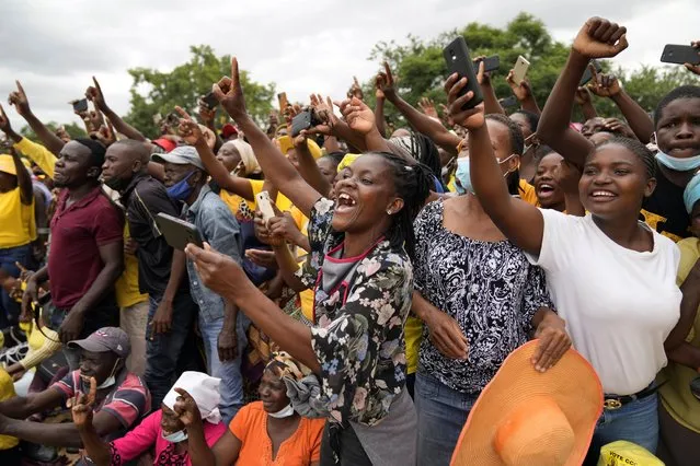 Supporters of Zimbabwean main opposition leader Nelson Chamisa greet him upon his arrival at a rally in Harare, Sunday, February 20,2022. Chamisa drew thousands of people at his first political rally since forming a new party weeks ago, as the country gears for elections that had been postponed due to COVID-19.(Photo by Tsvangirayi Mukwazhi/AP Photo)