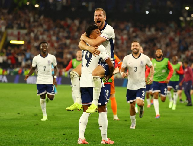 England's Harry Kane celebrates with Ollie Watkins after winning their Euro match against Netherlands, in Dortmund, Germany on July 10, 2024. (Photo by Kai Pfaffenbach/Reuters)