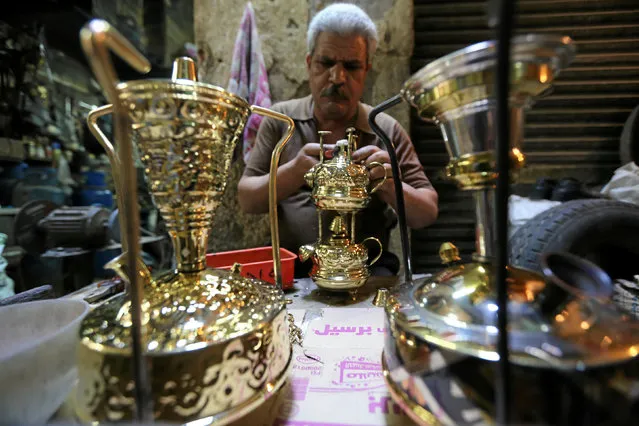 A worker manufacturing primus stoves known as “Bagour” in Arabic, in Cairo, Egypt, May 11, 2016. (Photo by Mohamed Abd El Ghany/Reuters)