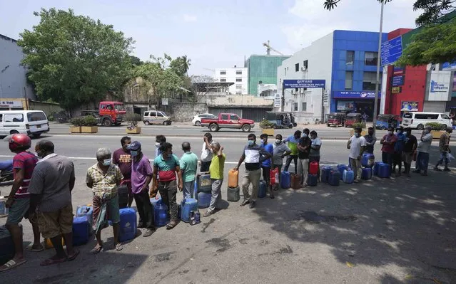 Sri Lankans queue to buy fuel at a fuel pump in Colombo, Sri Lanka, Thursday, March 3, 2022. Sri Lanka’s already dire economic crisis has deepened as oil prices hover near $110 a barrel. (Photo by Eranga Jayawardena/AP Photo)