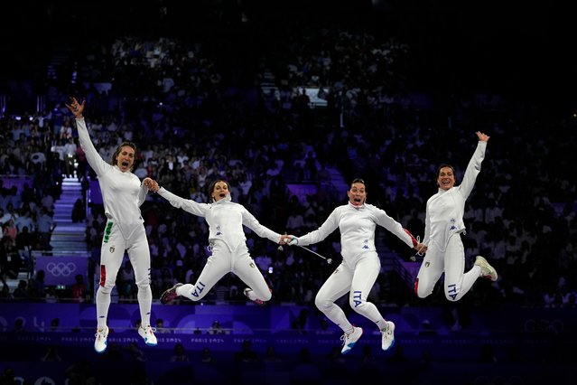 Team Italy celebrate victory during the Fencing Women's Epee Team Gold Medal match between Team France and Team Ital on day four of the Olympic Games Paris 2024 at Grand Palais on July 30, 2024 in Paris, France. (Photo by Andrew Medichin/AP Photo)