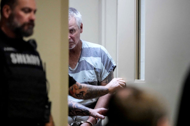 Colin Gray, 54, the father of Apalachee High School shooter Colt Gray, who is charged as an adult with four counts of murder in the deaths of Mason Schermerhorn and Christian Angulo, both 14, Richard Aspinwall, 39, and Cristina Irimie, 53, walks in the Barrow County courthouse on the day of his and his son's first appearence, in Winder, Georgia, U.S., September 6, 2024. (Photo by Brynn Anderson/Pool via Reuters)