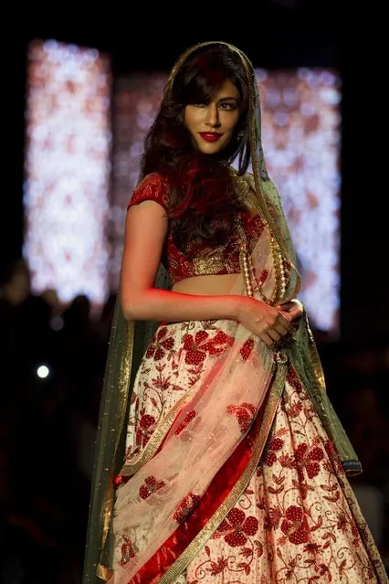 Indian Bollywood actress Chitrangada Singh displays a creation by Indian designer Debarun Mukherjee at the Amazon India Couture Week 2015 in New Delhi, India, Saturday, August 1, 2015. (Photo by Tsering Topgyal/AP Photo)