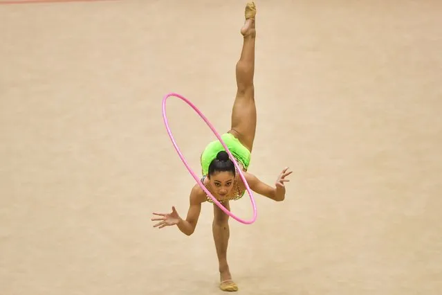 Phillipines' Breanna Labadan competes in the rhythmic gymnastics women's qualifications event during the 31st Southeast Asian Games (SEA Games) in Hanoi on May 18, 2022. (Photo by Ye Aung Thu/AFP Photo)