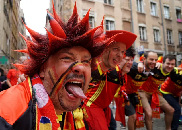 Belgium fans celebrate in the city of Lyon in eastern France, on June 13, 2016, prior to their Euro 2016 football match against Italy. (Photo by Vincenzo Pinto/AFP Photo)