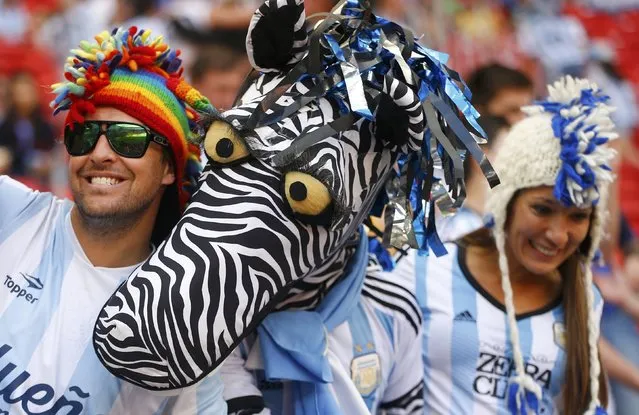 Argentina fans cheer before the 2014 World Cup quarter-finals between Argentina and Belgium at the Brasilia national stadium in Brasilia July 5, 2014. (Photo by Dominic Ebenbichler/Reuters)
