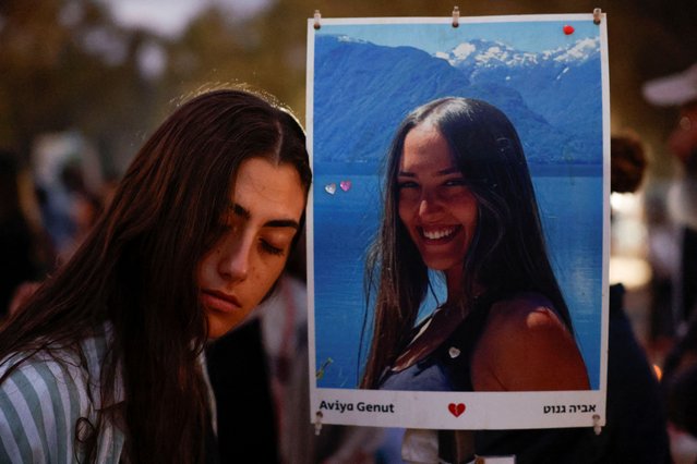 A woman attends a gathering to mark one year since partygoers were killed and kidnapped during the deadly October 7 attack by Hamas, at the site of the Nova festival in Reim, southern Israel, on October 7, 2024. (Photo by Amir Cohen/Reuters)