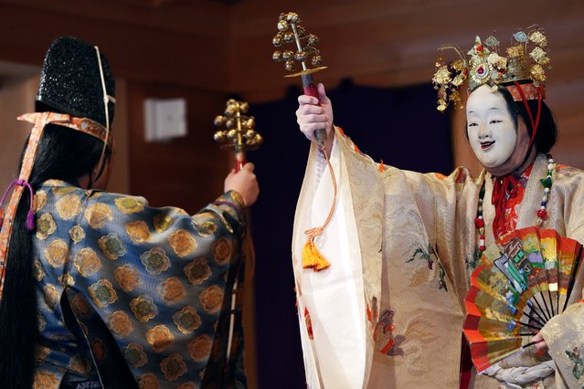 Dancers perform a “Noh” dance-drama during the annual Shinto festival called the Grand Festival at the Kotohiragu shrine in the Toranomon business district of Tokyo, Thursday, October 10, 2024. (Phoot by Eugene Hoshiko/AP Photo)