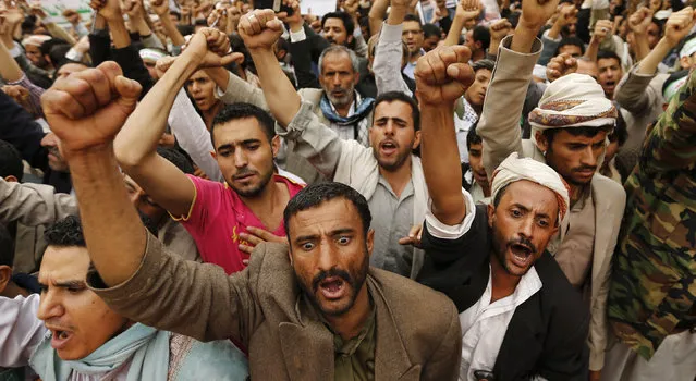 People shout slogans as they demonstrate to denounce Israeli air strikes on the Gaza strip, in Sanaa, Yemen on July 10, 2014. (Photo by Khaled Abdullah/Reuters)