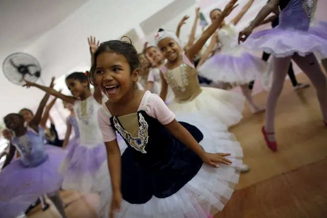 Young girls take ballet lessons at the New Dreams dance studio in the Luz neighborhood known to locals as Cracolandia (Crackland) in Sao Paulo, Brazil, August 14, 2015. (Photo by Nacho Doce/Reuters)