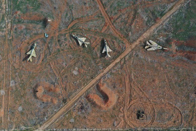 Seized Syrian Air Force planes are seen in the aftermath of the opposition's takeover of the city at the Hama military airport, Syria, Friday, December 6, 2024. (Photo by Ghaith Alsayed/AP Photo)