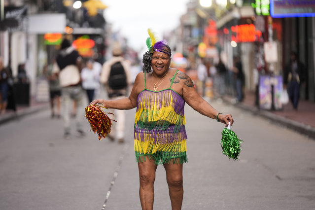 Street performer “Marie Francois, Queen of Bourbon Street” dances to music in the French Quarter Wednesday, February 5, 2025, ahead of Super Bowl 59 between the Philadelphia Eagles and the Kansas City Chiefs in New Orleans. (Photo by Gerald Herbert/AP Photo)