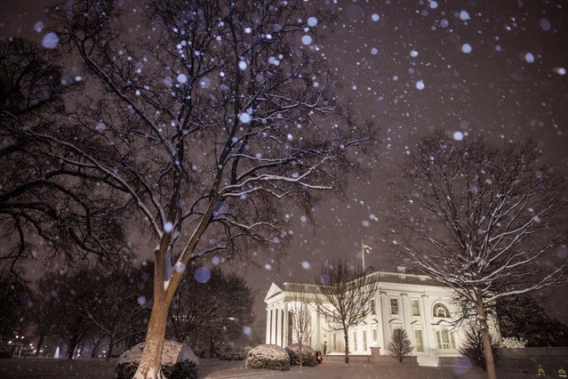 The North Lawn of the White House is seen covered by snow in Washington, DC, on February 11, 2025. (Photo by Ting Shen/AFP Photo)