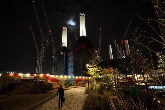Battersea Power Station's two front chimneys are lit up for the first time since they were rebuilt on November 2, 2017 in London, England. The lights on the North East and North West chimneys of Battersea Power Station are tested ahead of being officially turned on tomorrow, November 4, 2017 to celebrate the annual Battersea Park fireworks. It will be the first time the chimneys have been lit since being rebuilt earlier this year and painted their original colour. They will be lit every evening until Christmas to celebrate the completion of the first part of the new town centre, home to an ongoing programme of events, new shops and restaurants. (Photo by Jack Taylor/Getty Images for Battersea Power Station)