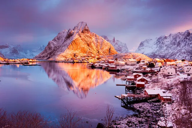 Reine, Lofoten, Norway. Lots of windy days and nights during our trip, but on this particular morning, we were extremely lucky to have freshly fallen snow and little wind. A few minutes after this shot was taken, the clouds and fog enveloped the area, blocking the sun, but leaving behind more beautiful snow. (Photo by Vicki Mar/Getty Images)