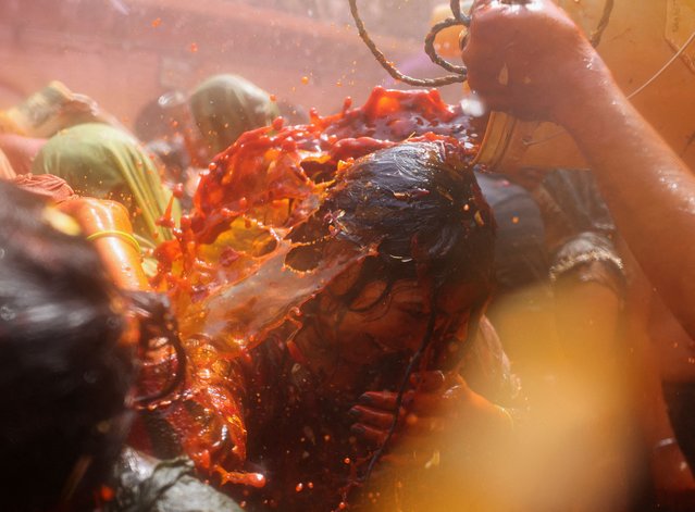 A woman reacts during Huranga, a game played between men and women a day after Holi, at Dauji temple near the northern city of Mathura, India, on March 15, 2025. (Photo by Anushree Fadnavis/Reuters)