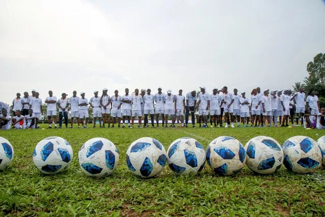 Local coaches stand during the FIFA Football for Schools programme, which trains sports educators to provide quality training to young people and schoolchildren in Abidjan, Ivory Coast on November 9, 2022. (Photo by Luc Gnago/Reuters)