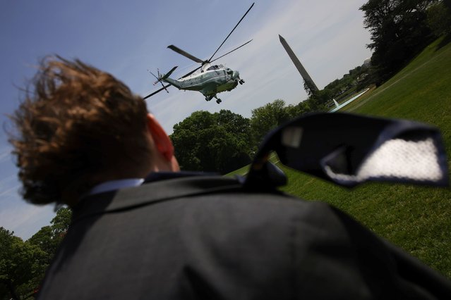A media member’s necktie blows in the wind as Marine One lifts off from the South Lawn of the White House in Washington, DC, on Tuesday, April 29, 2025. (Photo by Bryan Dozier/NurPhoto/AP Photo)