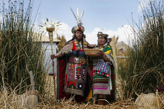 An Andean man and a woman, depicting Inca's legendary characters Manco Capac and Mama Ocllo, pose for a portrait in a Uros island at Lake Titicaca before a re-enactment in Puno November 5, 2014. The Uros islands are a group of 70 man-made totora reed islands floating on the lake, which according to Peru's tourism board iPeru is the world's highest navigable lake at over 4,000 meters above sea level. (Photo by Enrique Castro-Mendivil/Reuters)