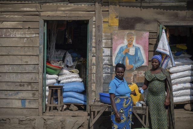 Two women stand together in the town near the coltan mining quarry in Rubaya, Democratic Republic of Congo, on Friday, May 9, 2025. (Photo by Moses Sawasawa/AP Photo)