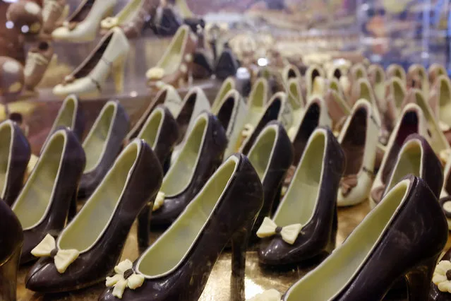 Chocolate shoes are displayed during a show as part of the chocolate fair in Paris, Tuesday, October 27, 2015. (Photo by Jacques Brinon/AP Photo)