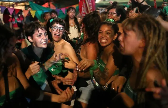 Demonstrators in favour of legalizing abortion attend a rally as the senate debates an abortion bill, in Buenos Aires, Argentina, December 30, 2020. (Photo by Agustin Marcarian/Reuters)