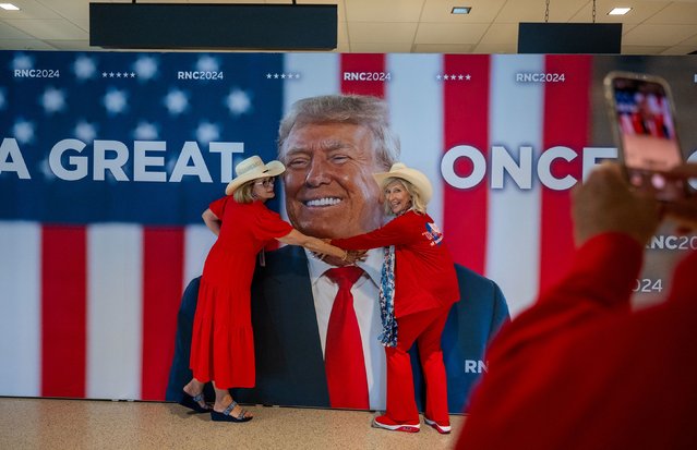 Kay Hall and Sharon Henson, both from Texas, pose with a poster of former US President Donald Trump as they attend the Republican National Convention in Milwaukee on Monday, July 15, 2024. (Photo by Rebecca Wright/CNN)