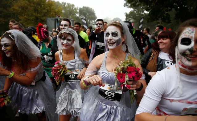 Participants line up at the start of a Trick or Treat halloween fun run in Richmond Park, London, Britain October 30, 2016. (Photo by Peter Nicholls/Reuters)