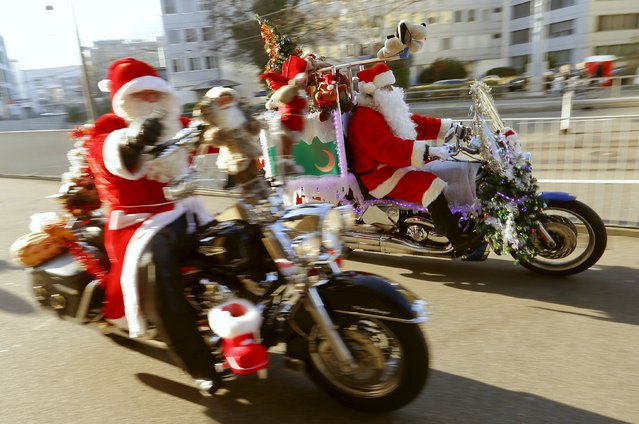 Harley Davidson bikers dressed as Santa Claus take part in a charity ride in Zurich, Switzerland December 6, 2015. (Photo by Arnd Wiegmann/Reuters)
