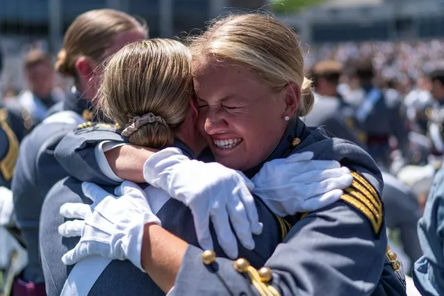 Graduation cadets congratulate each other at the end of the 2023 graduation ceremony at the United States Military Academy (USMA), at Michie Stadium in West Point, New York, U.S., May 27, 2023. (Photo by Eduardo Munoz/Reuters)