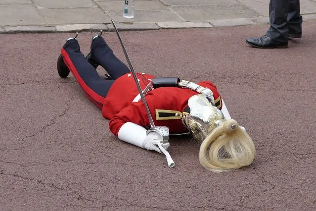 A member of the Household Cavalry faints ahead the Order of the Garter service at Windsor Castle on June 19, 2023 in Windsor, England. (Photo by Kirsty Wigglesworth-WPA Pool/Getty Images)