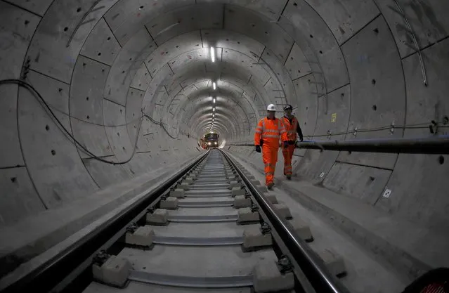 Workers lay railway track in a tunnel of the Crossrail project in Stepney, east London, Britain, November 16, 2016. (Photo by Stefan Wermuth/Reuters)