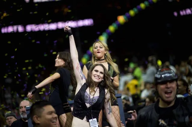 Defending champion of the 23rd annual Wing Bowl Molly Schuyler (C) parades through the Wells Fargo Center before the competition in Philadelphia, Pennsylvania January 30, 2015. (Photo by Mark Makela/Reuters)
