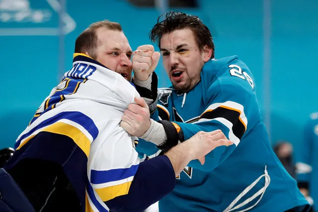 St. Louis Blues left wing Kyle Clifford (13) and San Jose Sharks right wing Kurtis Gabriel (29) fight during the first period at SAP Center at San Jose in California, USA on March 8, 2021. (Photo by Darren Yamashita/USA TODAY Sports)