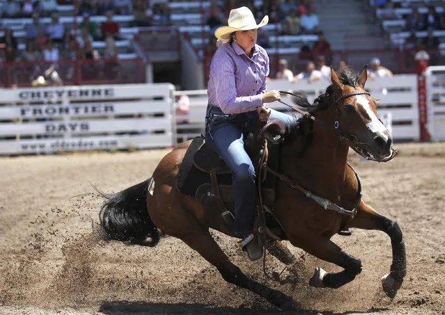 Amanda Fischer of Evansville, Wyo., competes during the annual Cheyenne Frontier Days slack rodeo barrel racing competition on Monday, July 16, 2018, at Frontier Park Arena in Cheyenne, Wyo. (Photo by Jacob Byk/The Wyoming Tribune Eagle via AP Photo)
