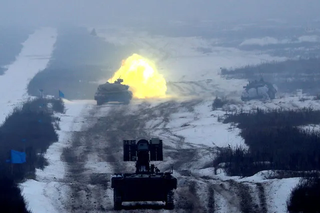 A tank fires during military exercises in the Ukrainian Ground Forces training centre near Honcharivske in Chernihiv region, Ukraine December 3, 2018. (Photo by Valentyn Ogirenko/Reuters)