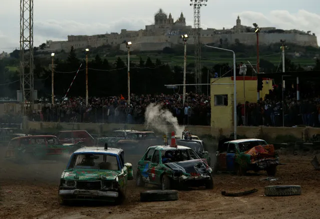 Drivers take part in a demolition derby organised by the Malta Motor Sports Association to raise funds for charity in Ta' Qali beneath the fortified city of Mdina, outside Valletta, Malta, January 8, 2017. (Photo by Darrin Zammit Lupi/Reuters)