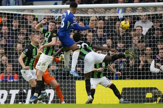 Chelsea's Levi Colwill, top center, scores his side's second goal during the English Premier League soccer match between Chelsea and Brighton and Hove Albion, at Stamford Bridge stadium in London, Sunday, December 3, 2023. (Photo by Alastair Grant/AP Photo)
