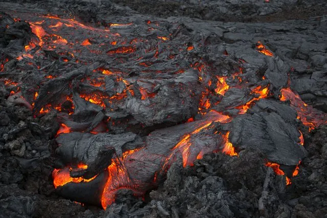 The molten lava from the Plosky Tolbachik volcano. (Photo by Denis Budkov/Caters News)