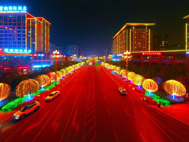 The Spring Festival lighting decorations are illuminating the city's main road in Chongqing, China, on the evening of January 30, 2024. (Photo by Costfoto/NurPhoto/Rex Features/Shutterstock)